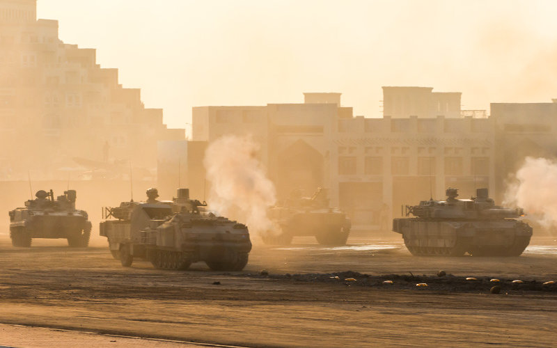 Tanks firing at sunset