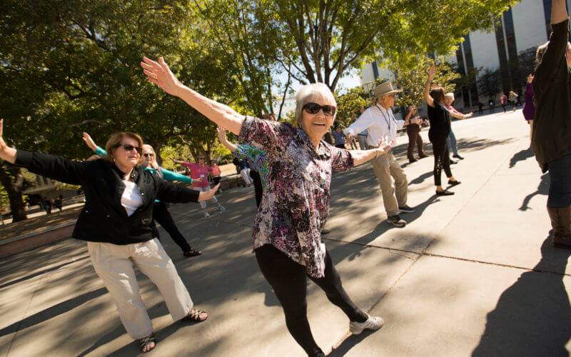 Ruth Tash and other OLLI members perform on campus.