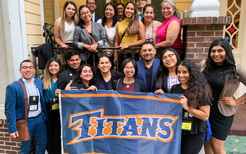 HACU Group Photo with Titan Flag