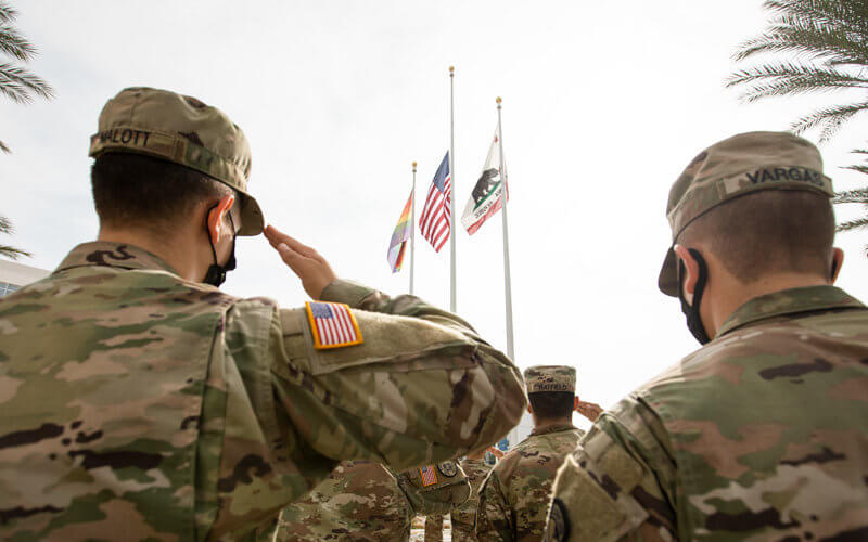 ROTC Cadets salute as flag rises