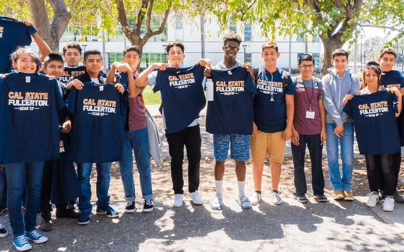 Gear Up Students holding branded T-Shirts