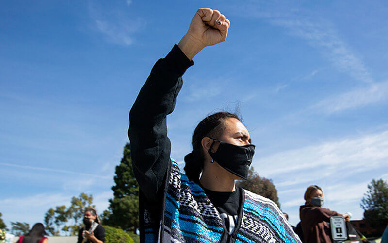 Native American raising fist during protest