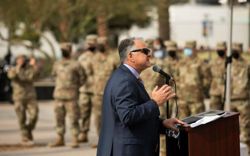 Fram Virjee speaking at podium