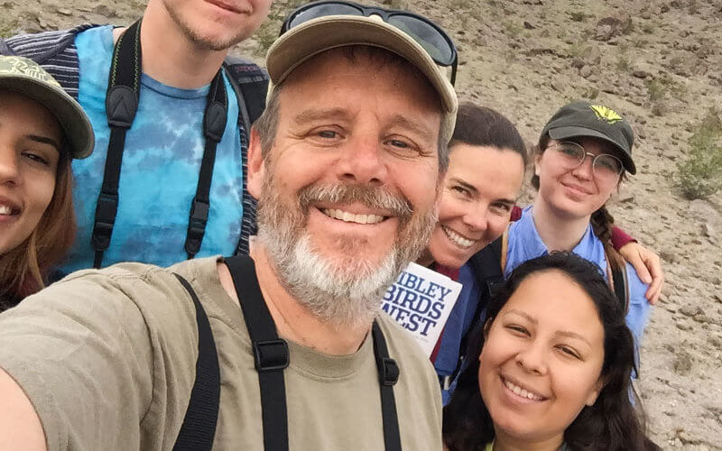 William Bill Hoese takes a photo with students in summer research program.