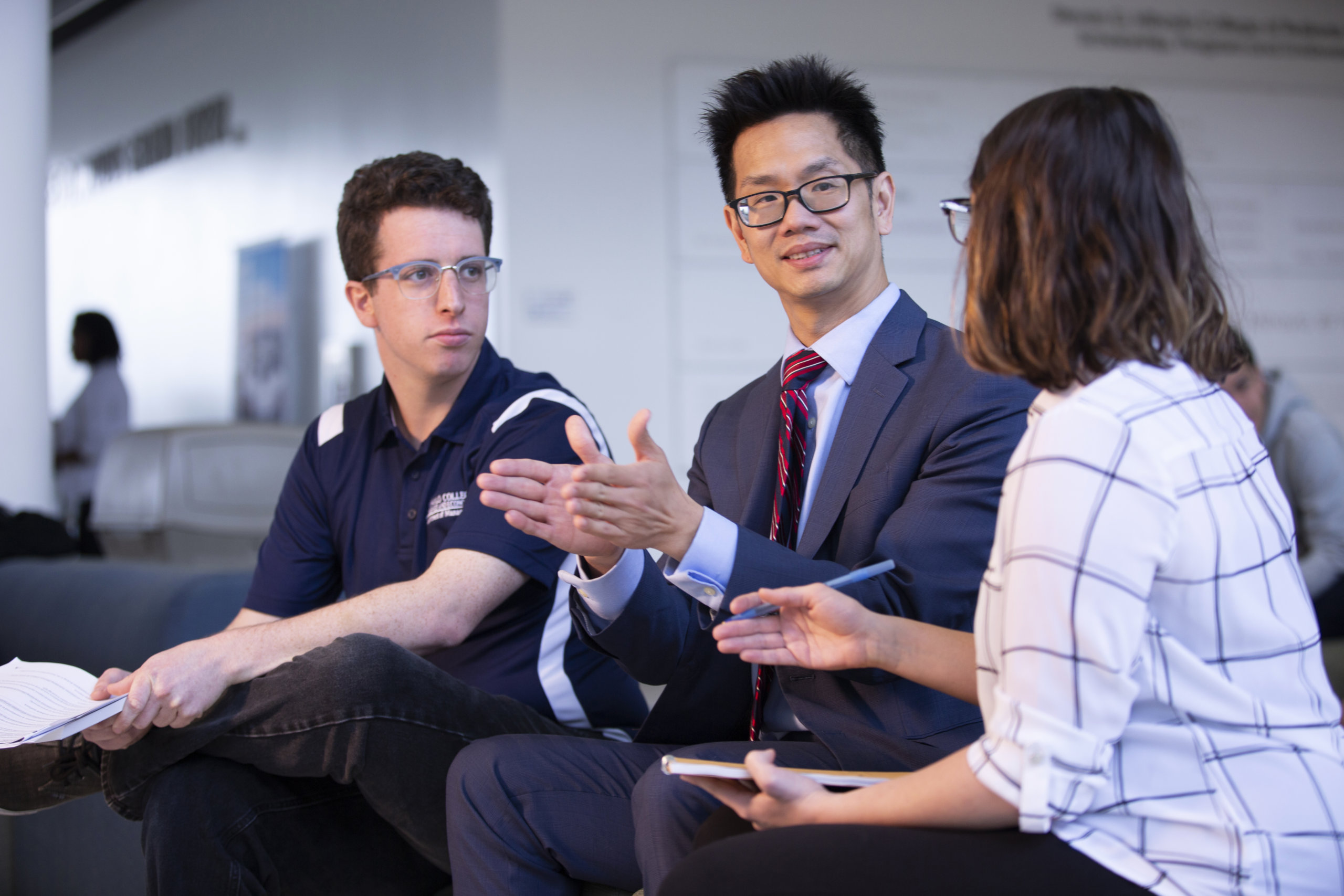 Economics professor shares research with students.