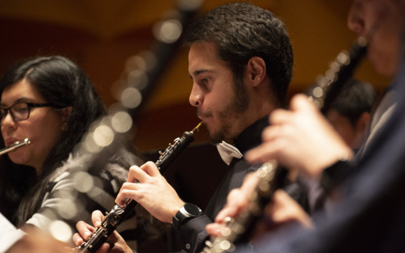 Jesus Ramos playing wind instrument