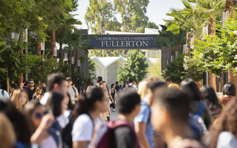 people walking on a college campus