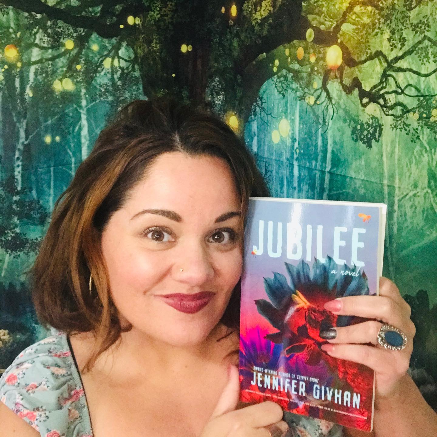 Image of poet Givhan holding her book