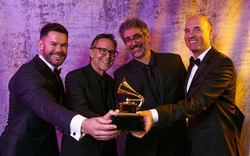 Group holding Grammy award