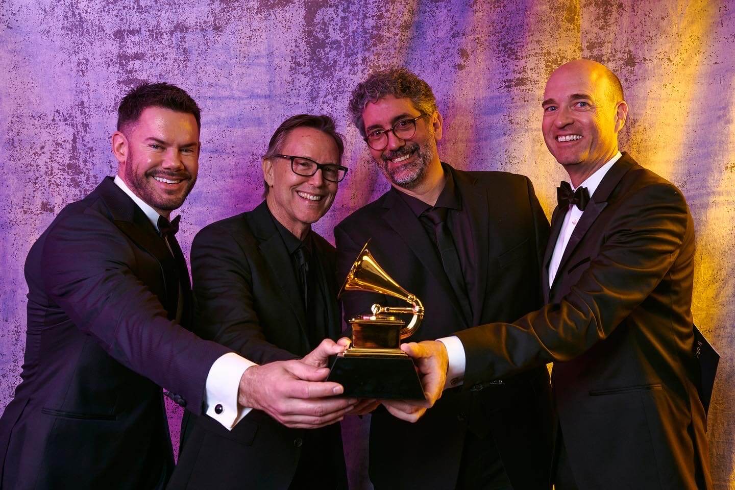 Group holding Grammy award