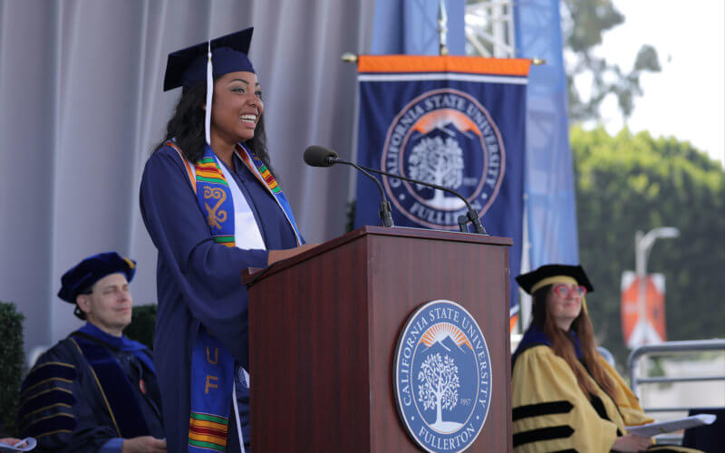 Deeyanna Pedersen speaking at podium