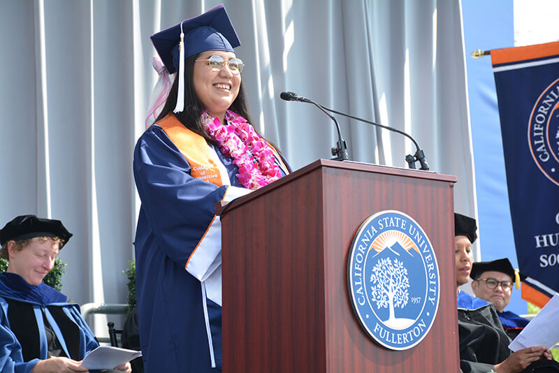 Marisela Dorado speaks at podium