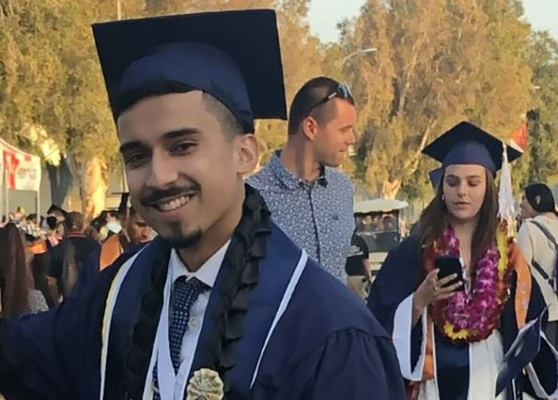 Peter Mancilla smiles for photo
