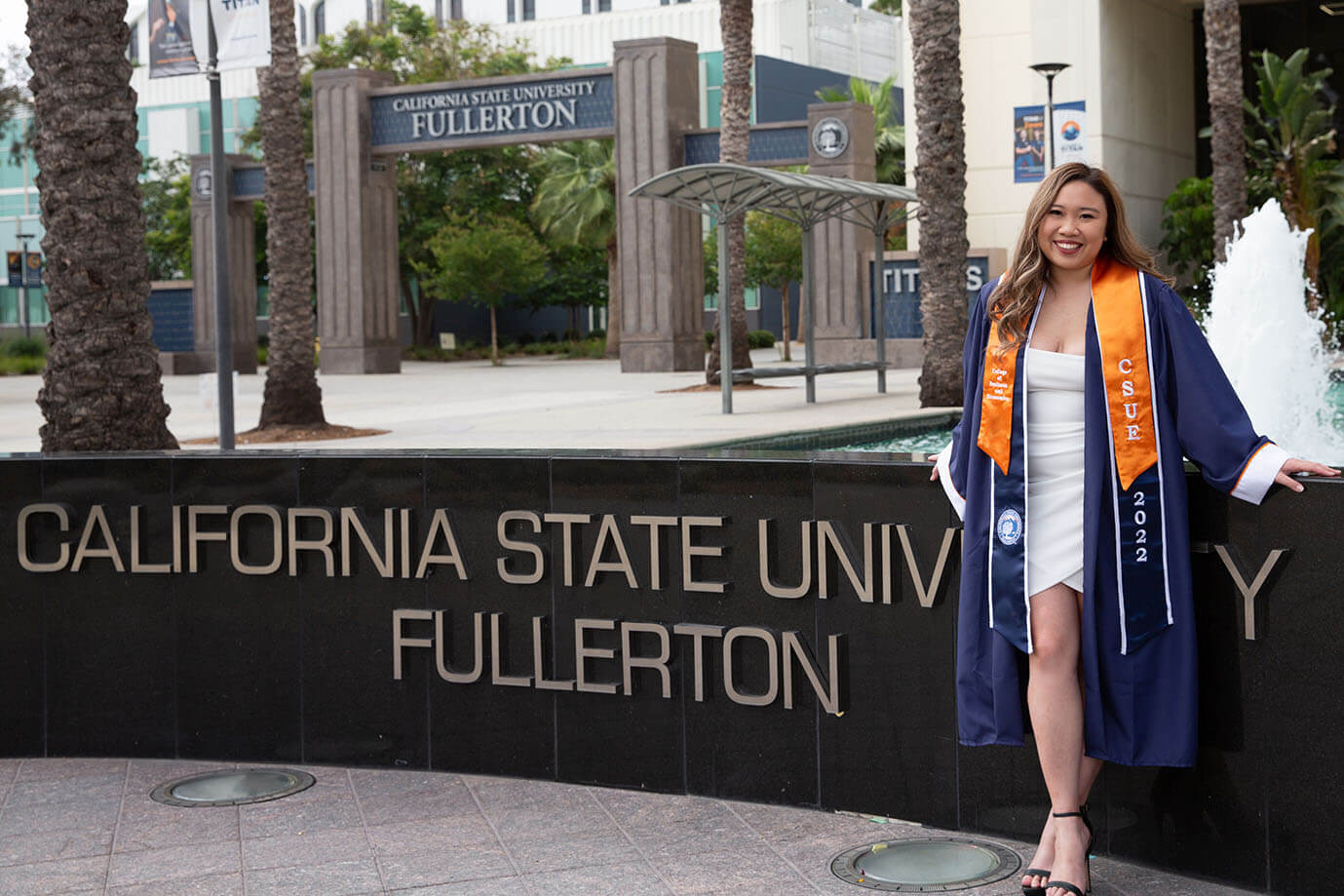 Vivian Yenson posing in front of "California State University, Fullerton" sign