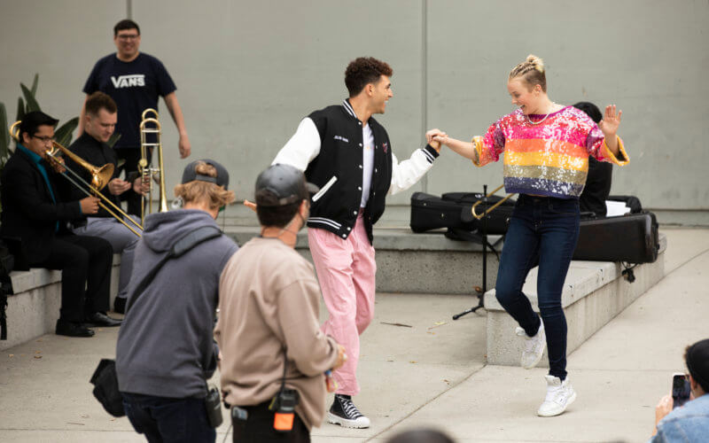 Jojo Siwa, right, dances with her friend Ezra Sosa.