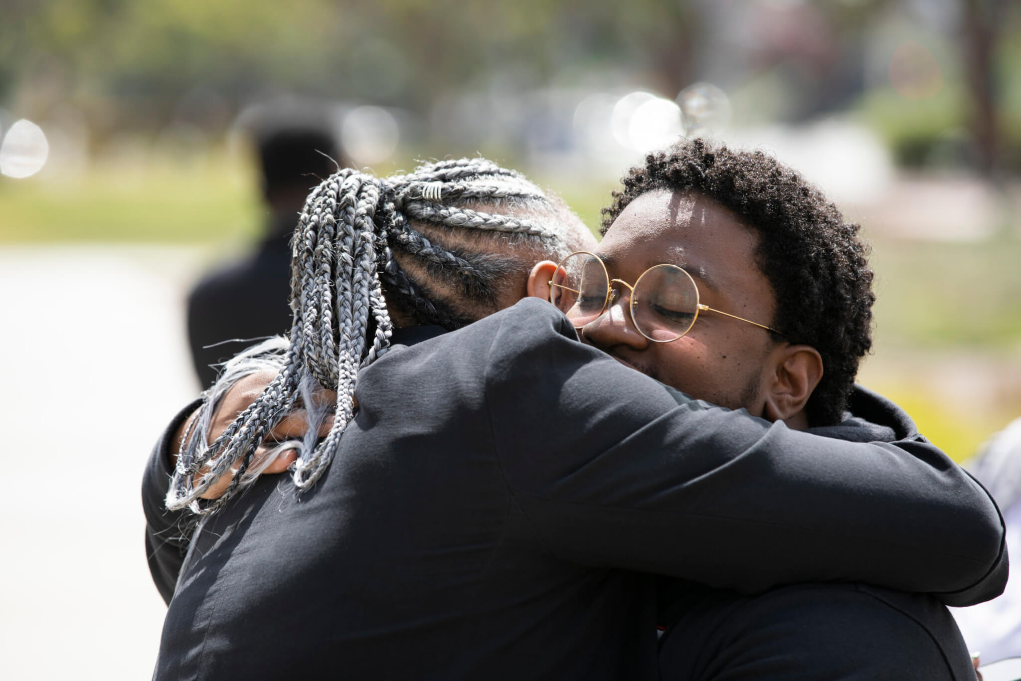 Criminal Justice Lecturer Monishia Miller, left, embraces Torrell Foree, the Coordinator of the African American Resource Center.
