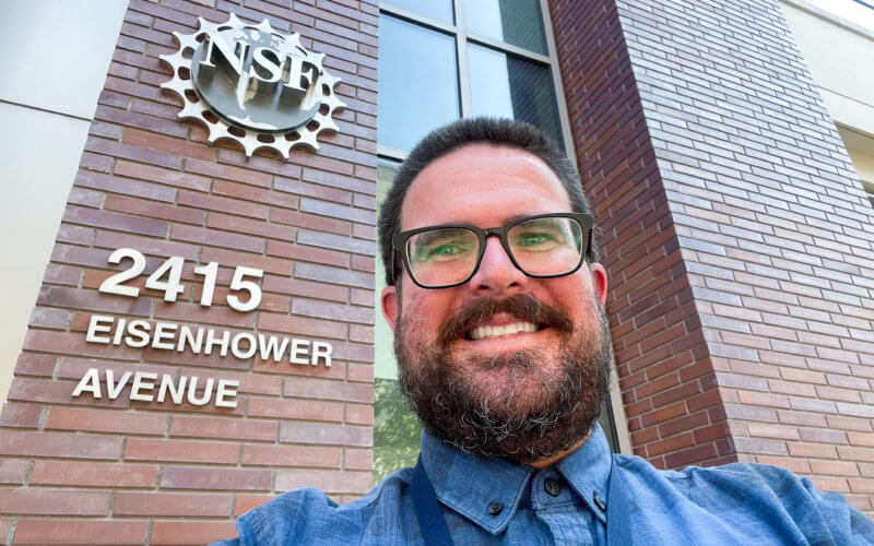 Joe Carlin in front of NSF building