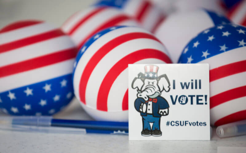 CSUF Votes Sticker and flags