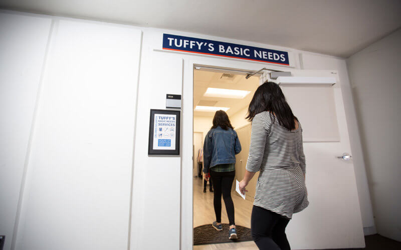 Students walk into Tuffy's Basic Needs center