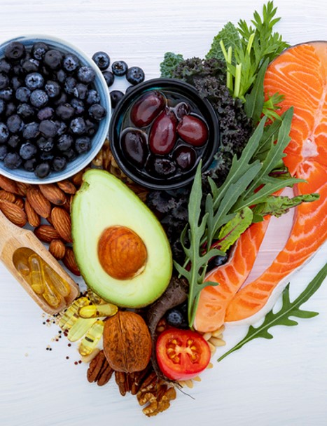 Plate of color fruits, vegetables, and salmon