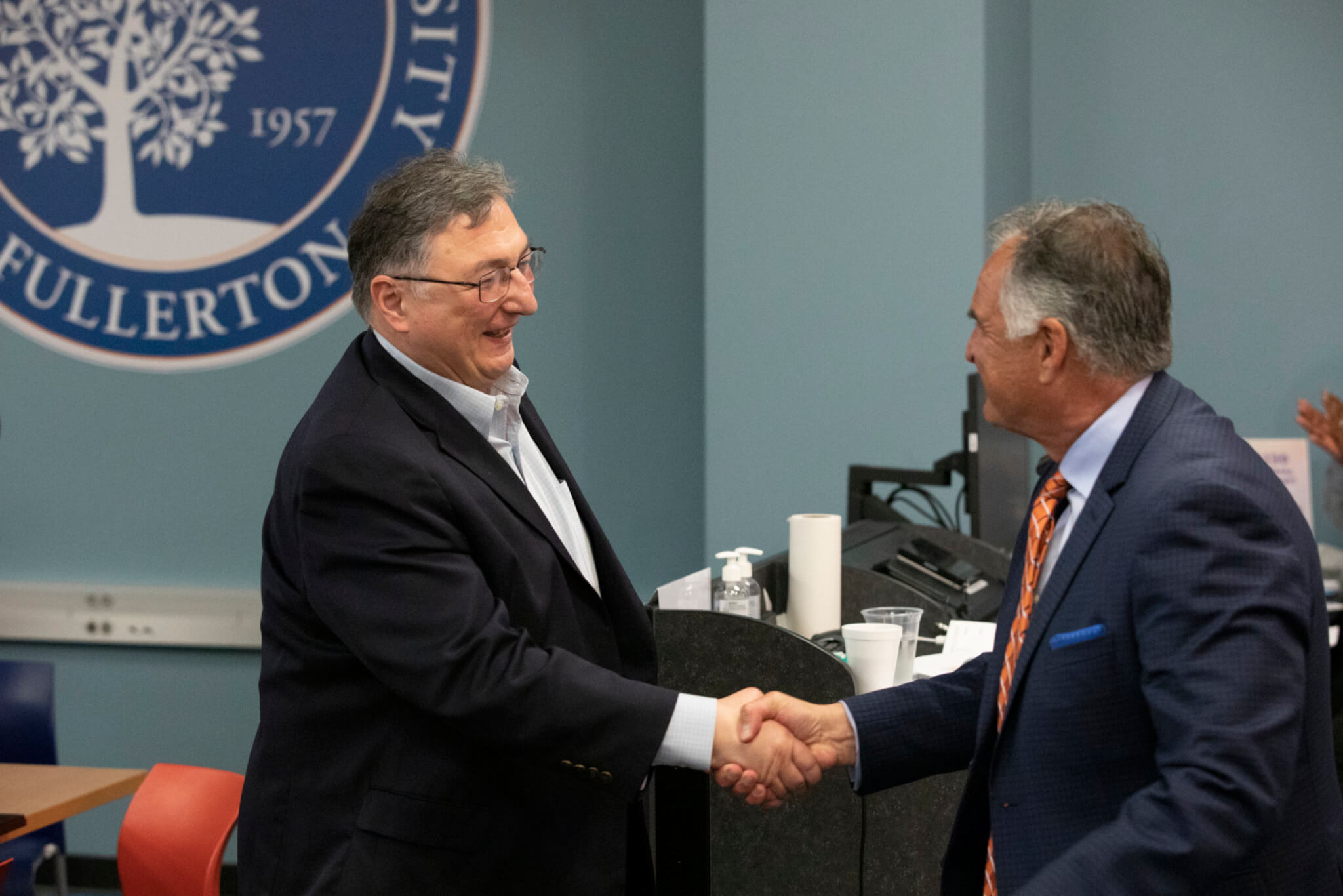 Outstanding Professfor Bogdan Suceava is congratulated by President Virjee