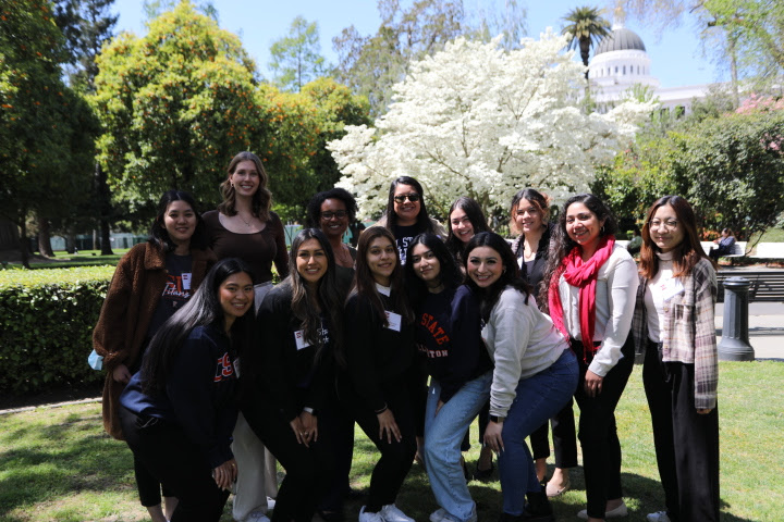 CSUF Public Health students and Dr. Jackson Preston, with trees and the state capitol in the background