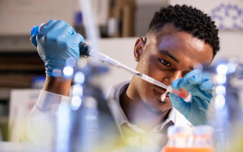 Ramadhan Ahmed working in laboratory