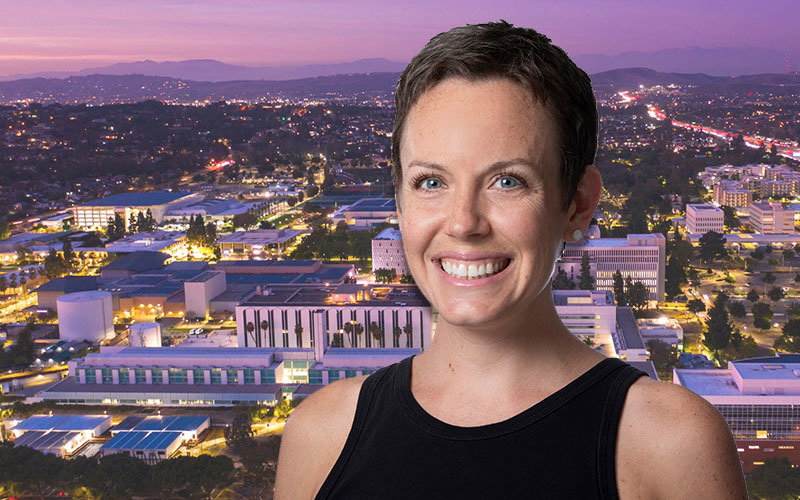 Headshot of Dr. Alison Marzocchi. She is photoshopped over a background, which is an aerial image of the Cal State Fullerton campus at sunset.
