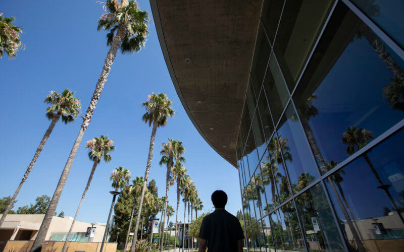 Student in front of Clayes Performing Arts Center