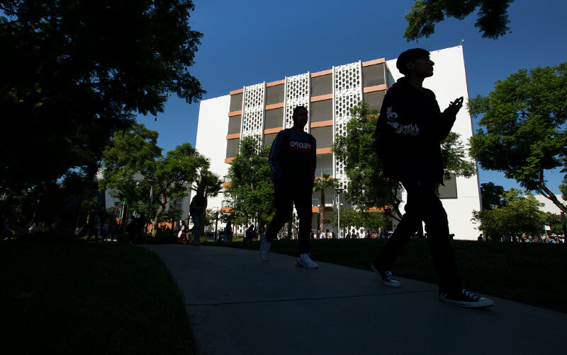 Students walk in front of McCarthy Hall