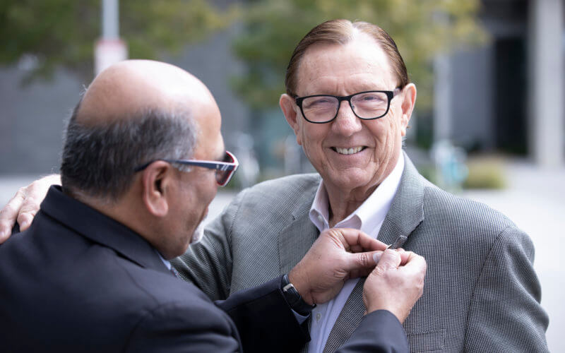 CBE Dean Sundaram places a pin on Paul Folino.