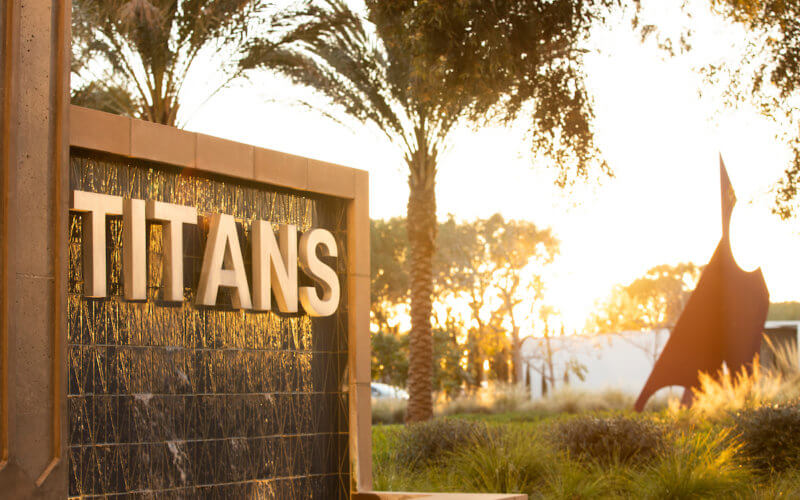 Titan Promenade Fountain Sign at sunset