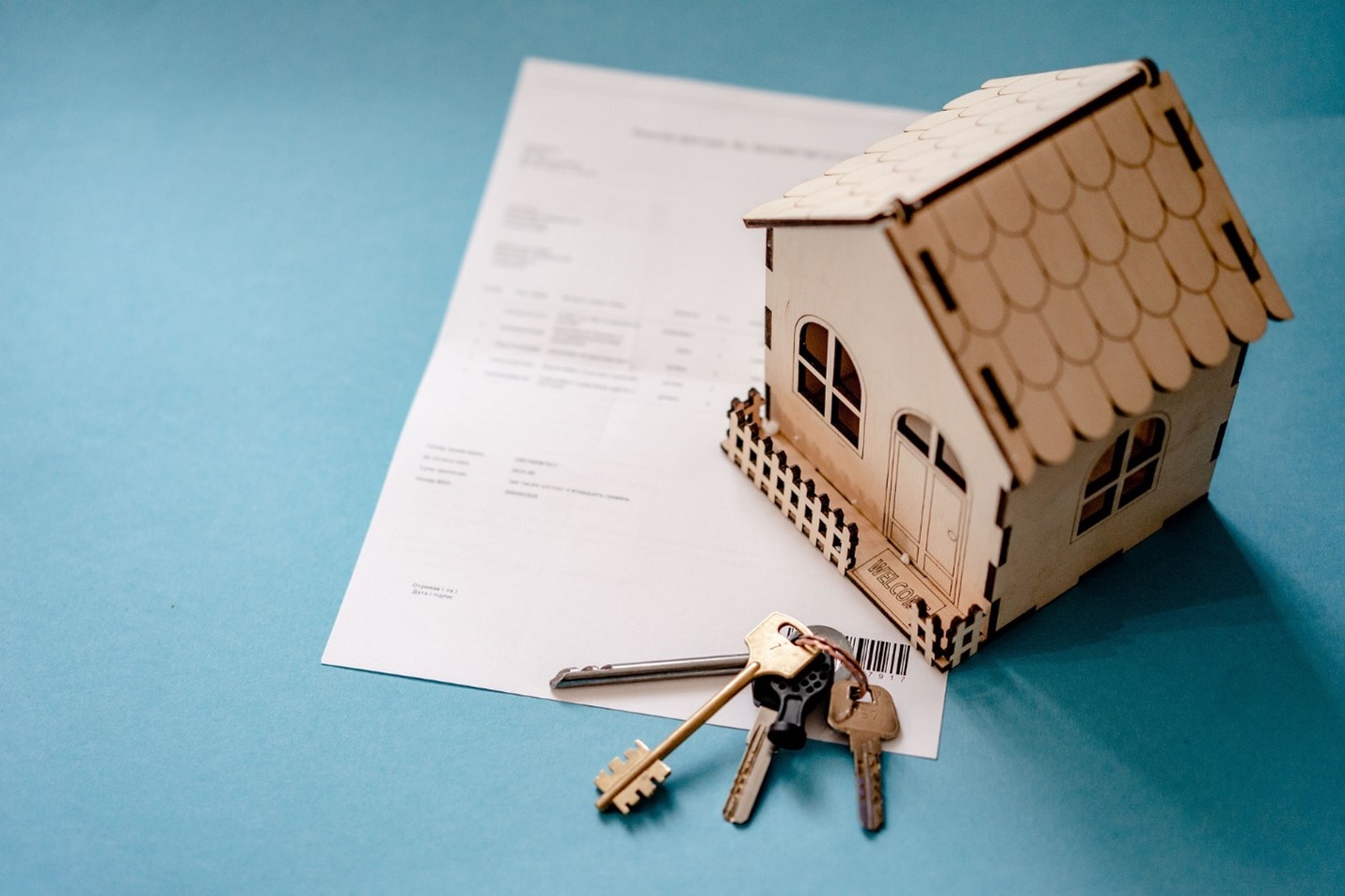 Stock image showing a home and keys, symbolizing homeownership