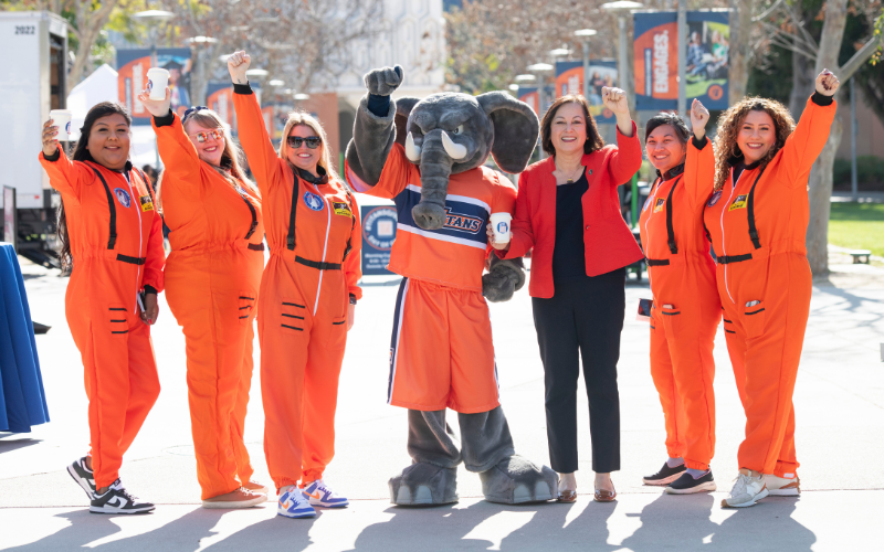 Tuffy and President Alva celebrating with Day of Giving campus event team
