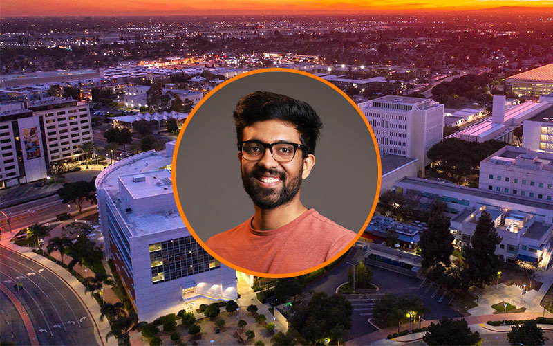 Circular image frame outlined in orange of Keshav Daga. Behind the frame is a background image of the Cal State Fullerton campus at sunset.