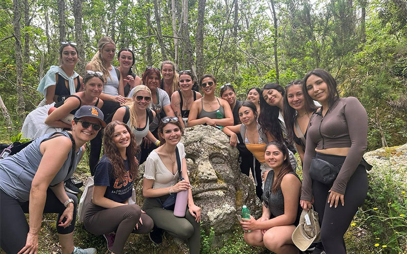 Large group of diverse female CSUF Public Health Students. They are hiking trip during their study abroad program in Italy.