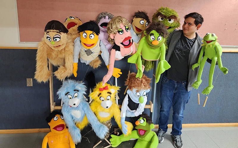 Theatre student Faris Khan with some of his puppet creations.