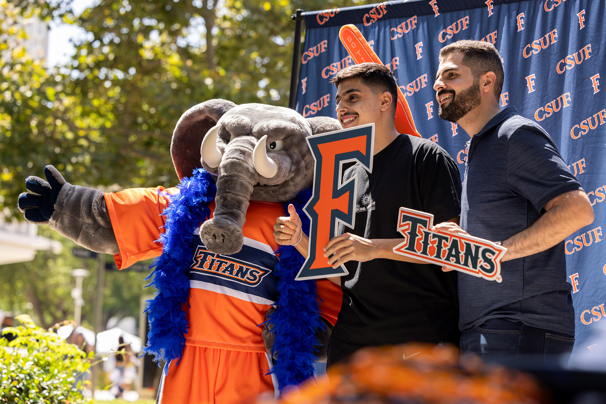 Attendees at Titan Welcome Weekend on Aug. 24 pose for a photo with Tuffy the Titan.