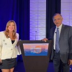 Mira Farka, left, and Anil Puri, pose at a podium at the 30th Annual Economic Forecast Conference on Oct. 24