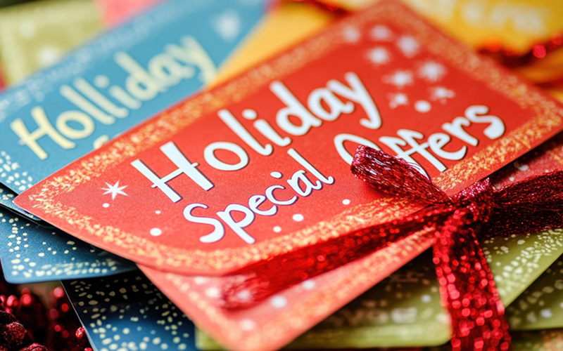 A stack of colorful coupons for holidays specials.