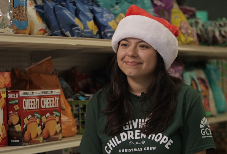 CSUF Sociology 306 student, Dianna Espinoza, at Giving Children Hope's food distribution center