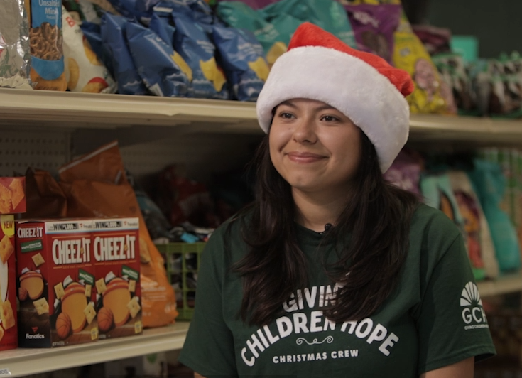 CSUF Sociology 306 student, Dianna Espinoza, at Giving Children Hope's food distribution center