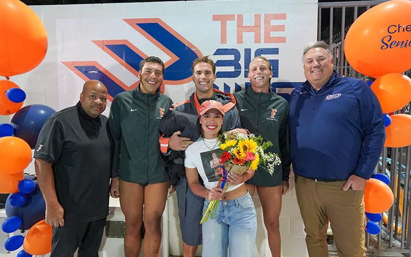 Bendeguz Aubeli with fellow members of CSUF men's water polo team on Senior Night.