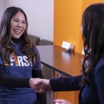 Lizeth Fuentes shakes hand with Elizabeth Zavala