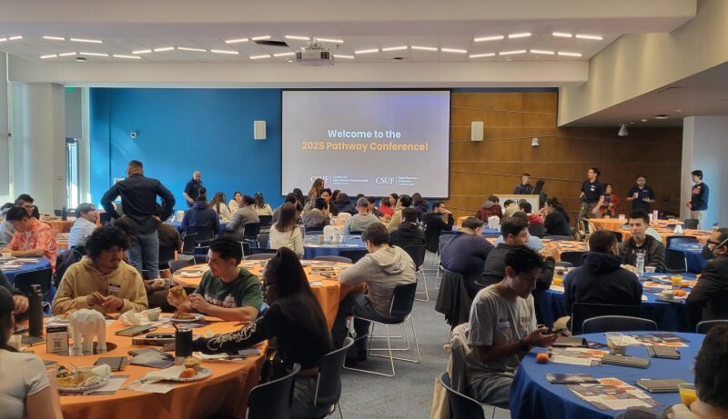 Community college transfer students sit at tables at the 2025 Annual Pathway Conference