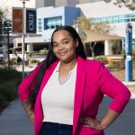 Amirah Kambe stands outside CSUF's College of Health and Human Development