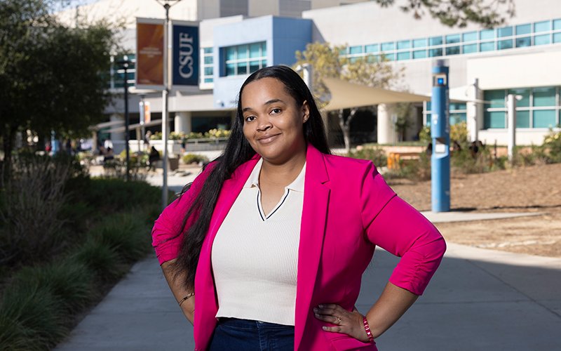 Amirah Kambe stands outside CSUF's College of Health and Human Development