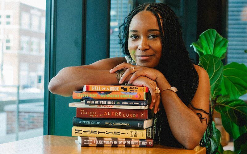 Onikah Asamoa-Caesar with books