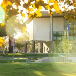 Titan letters are shown in front of Cal State Fullerton's Titan Student Union during autumn.