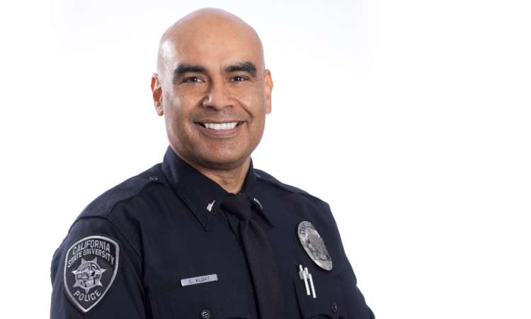 Lieutenant Cruz Alday smiling in his uniform against a white background